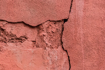 Old crack broken red concrete wall damage background cement cracked texture