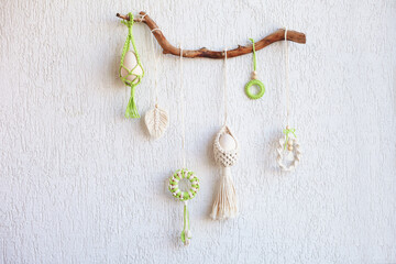 Macrame flower accessory. Easter time. Spring easter walhanging decor on wooden stick