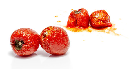 splattered rotten tomatoes isolated on white. Moldy, splashed and spoiled tomato. fruit, vegetable with a disease 