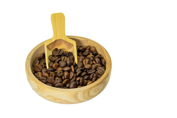 Roasted coffee beans in wooden bowl and spoon on white background