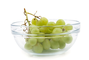 glass bowl containing a bunch of grapes