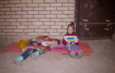 KIEV, UKRAINE - March 24, 2022: The war in Ukraine. the life of children in a bomb shelter at a...