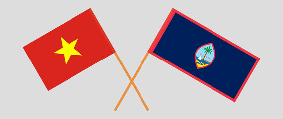 Crossed flags of Vietnam and Guam. Official colors. Correct proportion