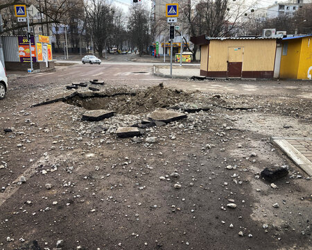 Kharkiv Ukraine 2022 Destruction in the city after the Russian attack. Destroyed infrastructure of the city. A shell crater in the courtyard of the city.
