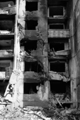 Destroyed houses of people in Kharkov after the shelling of Russian troops. Black and white photo of the war.