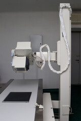 X-ray machine in the x-ray room. Against the background of a gray wall.