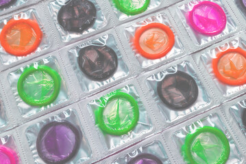 Colorful condoms background.