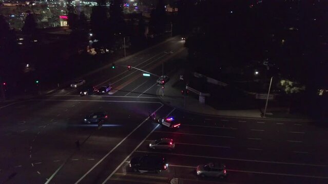 Police at Car Crash Intersection Night