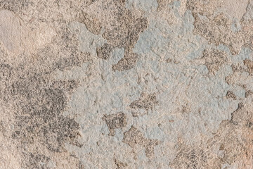 Peeling old plaster with damaged concrete wall cement weathered texture broken background