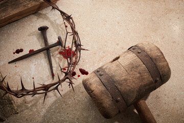 Crucifixion Of Jesus Christ. Wooden Cross With Nails And Crown Of Thorns on stone background