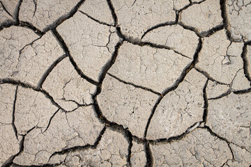 Cracked earth from dry reservoir bed.