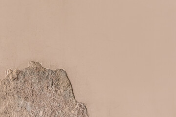 Peeling old plaster with damaged concrete wall cement weathered texture broken background