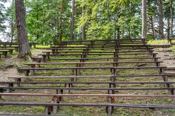 Empty Wooden Bench Rows in Park for Outdoor Events