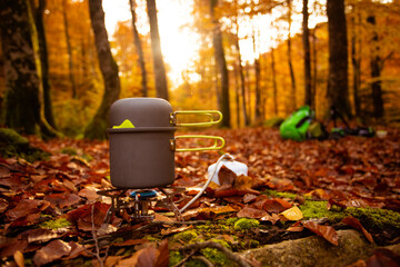 Cooking hot dish to warp up while autumn hiking