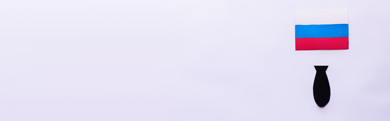 Top view of russian flag and paper bomb on white background, banner.