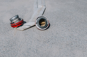 fire hose on the sidewalk