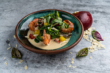 Fresh Shrimps, Avocado, Mango salad with lettuce green mix, herbs, lemon, healthy food.