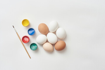 Template for easter with eggs and paint on a white background