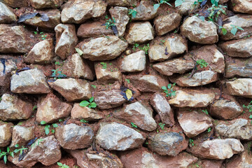 Close-up to stones decorate the walls background.