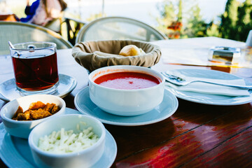 Tomato soup on wooden table in restaurant