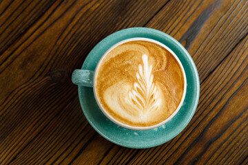 coffee with milk on a wooden table
