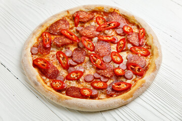 Italian pizza on a white wooden table
