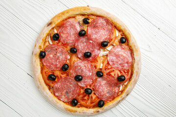 Italian pizza on a white wooden table
