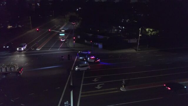 Police at Car Crash Intersection Night