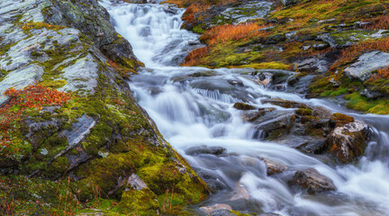 A stream flowing down the valley from the norwegian mountains