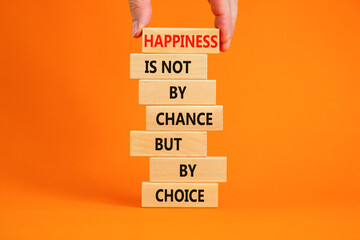 Happiness is choice symbol. Wooden blocks with words Happiness is not by chance but by choice. Beautiful orange background copy space. Businessman hand. Motivational Happiness is choice concept.