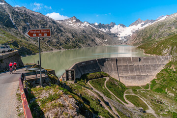 Oberaarsee, Switzerland - August 13, 2021: The Oberaarsee is the highest reservoir in the headwaters of the Aare in the canton of Bern in Switzerland