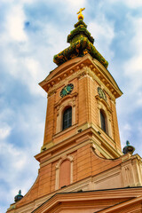 Fototapeta na wymiar Bell and clock tower of Serbian Orthodox church in Novi Sad, Serbia.