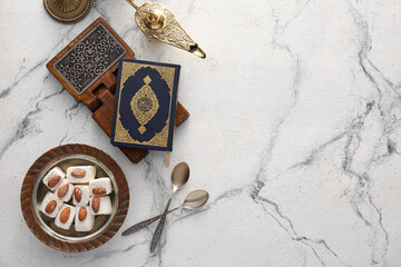 Tasty Turkish delight with Quran and Aladdin lamp on white background