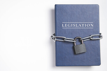 Legalization. Book with lock. A closed book is banned. Chain on the book.
