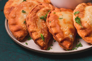 Fried mini pasties, with red sauce, top view, close-up, no people, selective focus,
