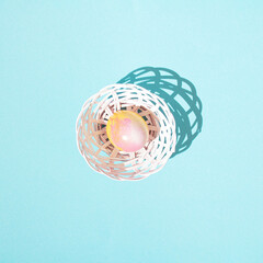 Easter basket and a pink egg.Light blue design