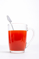 red hot drink in a glass mug on a white background