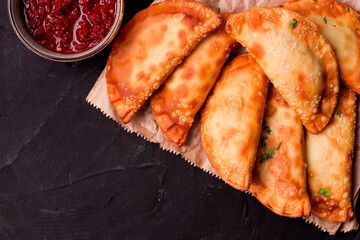 Fried mini pasties, with red sauce, top view, close-up, no people, selective focus,