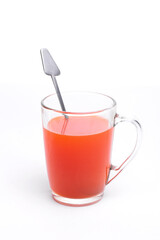 red hot drink in a glass mug on a white background