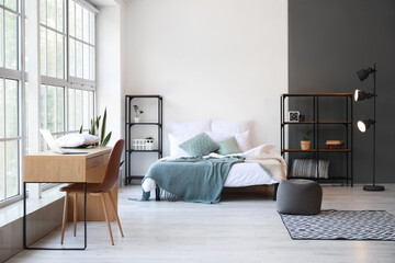 Interior of light modern bedroom with shelving units