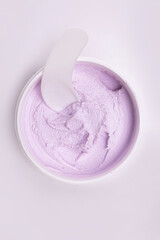 top view white jar with face cream close-up on a white background