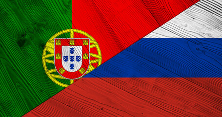 Background with flag of Portugal and Russia on divided wooden board. 3d illustration