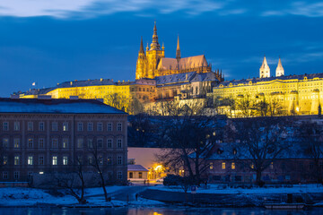 Naklejka premium A view of Prague Castle, which is the dominant feature of the capital city of Prague. Photographed in winter from Charles Bridge