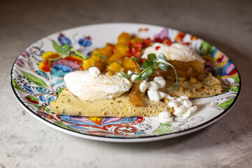fruit filling wrapped in a pancake on a beautiful plate