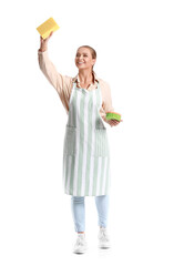 Young woman with sponges on white background