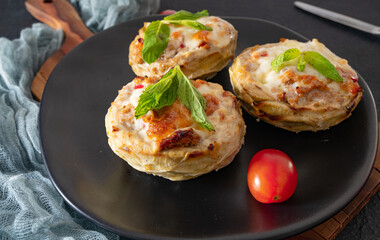 Artichoke dish with cheddar on black
