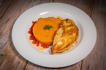 Chicken supreme recipe, gently cooked with 5 spices, sweet potato mousseline, peppers cut in half