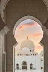 Beautiful architecture of the Grand Mosque in Abu Dhabi at sunset, United Arab Emirates