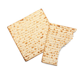 Torn Jewish flatbread matza for Passover on white background