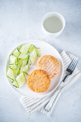 Shrimp patties with cucumber in a plate